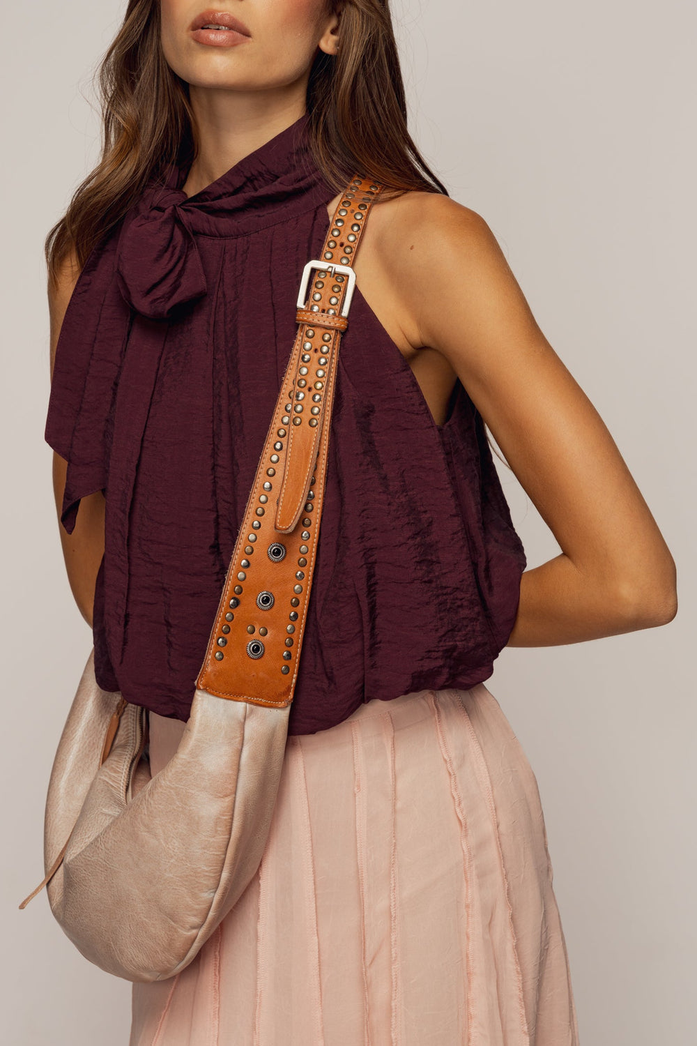 LUSHER MUSE SLING BAG, LUSHER BLUSH SLING BAG, LUSHER LEATHER SLING BAGS, BLUSH PINK LEATHER SLING BAG, STUDDED LEATHER SLING BAG, LUXURY FEMININE SLING BAG