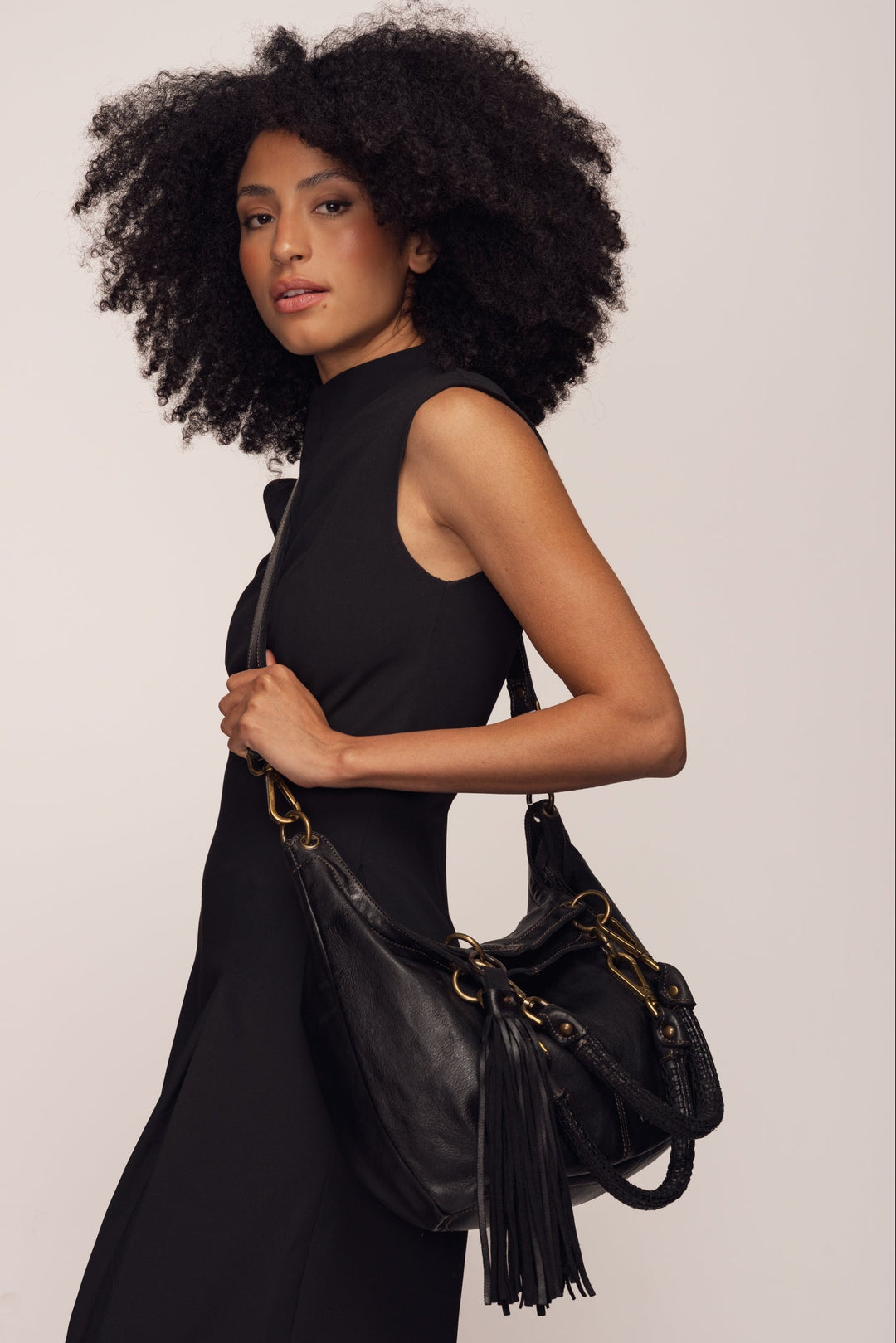 Calla Lily Convertible Hobo  - Black | LUSHER, Model wearing crossbody messenger style