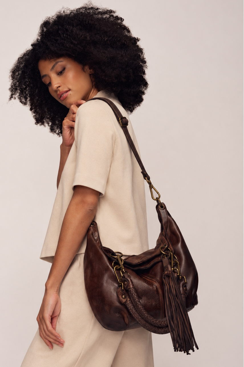 Lusher CAlla lily convertible hobo in chocolate brown worn as a  slouchy shoulder bag 