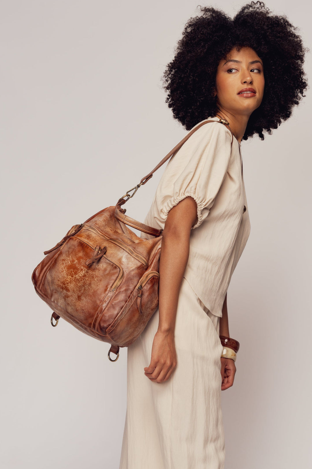 lusher quest backpack purse in gold cognac, soft slouchy leather backpack purse, leather backpack with exterior zip pockets, luxury Italian leather backpack, travel backpack