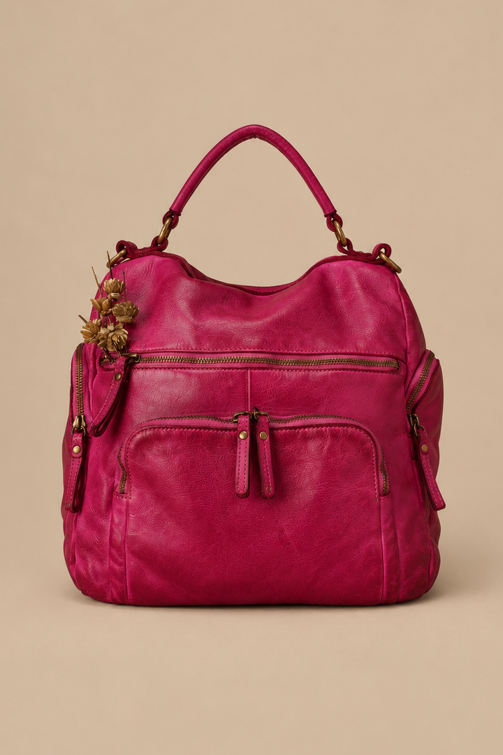 Lusher Original Quest Backpack Purse in Fuchsia View of the Front of the bag and 4 zip pockets