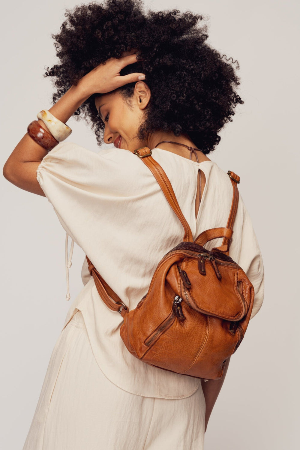 LUSHER SOFT AND SLOUCHY SMALL BACKPACK IN COGNAC, LUSHER + BAYSIDE84 COLLAB COLLECTION SOFT AND SLOUCHY SMALL BACKPACK, MINI LEATHER BACKPACK PURSE BY LUSHER.co