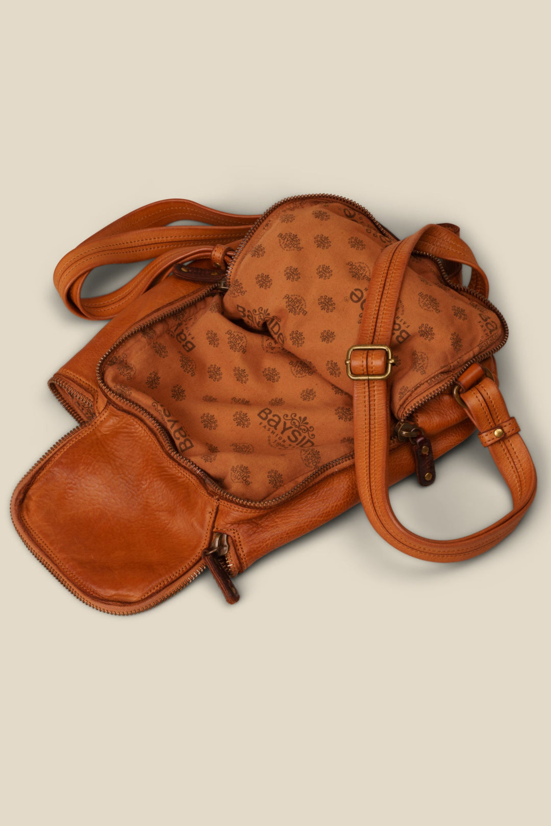 LUSHER SOFT AND SLOUCHY SMALL BACKPACK IN COGNAC, LUSHER + BAYSIDE84 COLLAB COLLECTION SOFT AND SLOUCHY SMALL BACKPACK, MINI LEATHER BACKPACK PURSE BY LUSHER.co