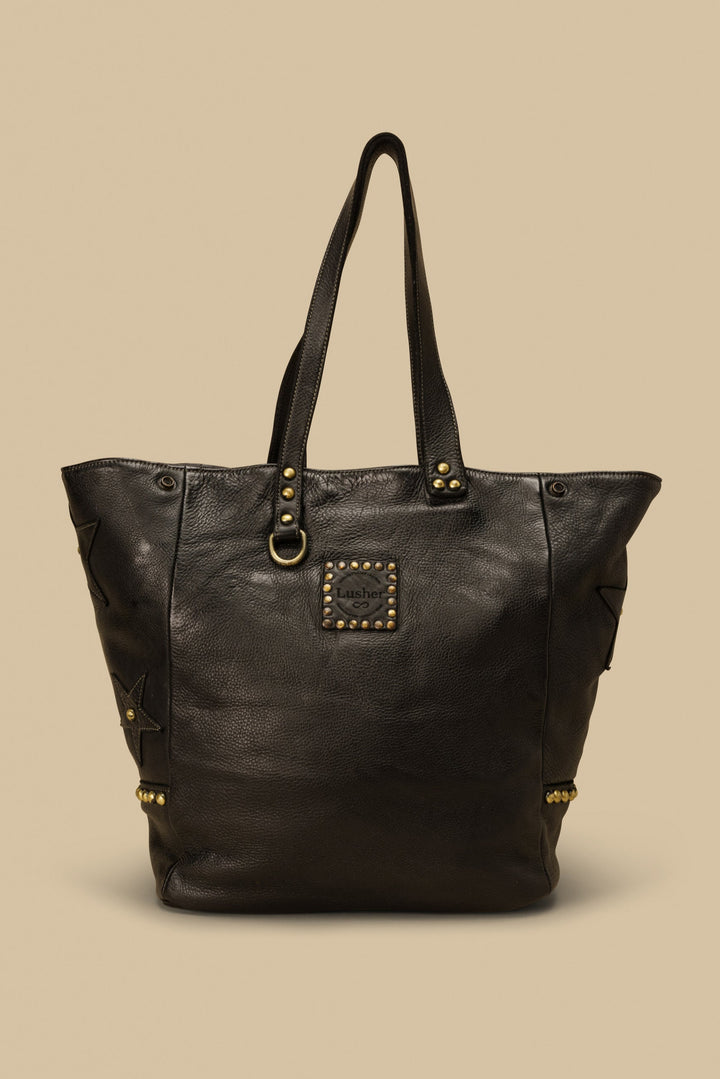 LUSHER STAR TOTE IN BLACK, LARGE LEATHER TOTE WITH STARS AND STUDS, STUDDED LEATHER TOTE BAG, STAR PURSE, PURSE WITH STARS, FREE PEOPLE TOTE BAG WITH STARS, 