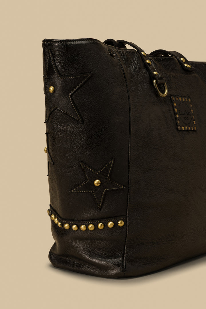LUSHER STAR TOTE IN BLACK, LARGE LEATHER TOTE WITH STARS AND STUDS, STUDDED LEATHER TOTE BAG, STAR PURSE, PURSE WITH STARS, FREE PEOPLE TOTE BAG WITH STARS, 
