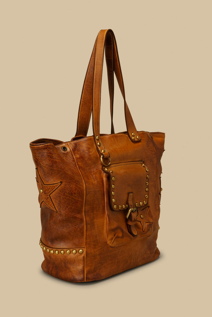 LUSHER STAR TOTE IN COGNAC, LARGE LEATHER TOTE WITH STARS AND STUDS, STUDDED LEATHER TOTE BAG, STAR PURSE, PURSE WITH STARS, FREE PEOPLE TOTE BAG WITH STARS, 