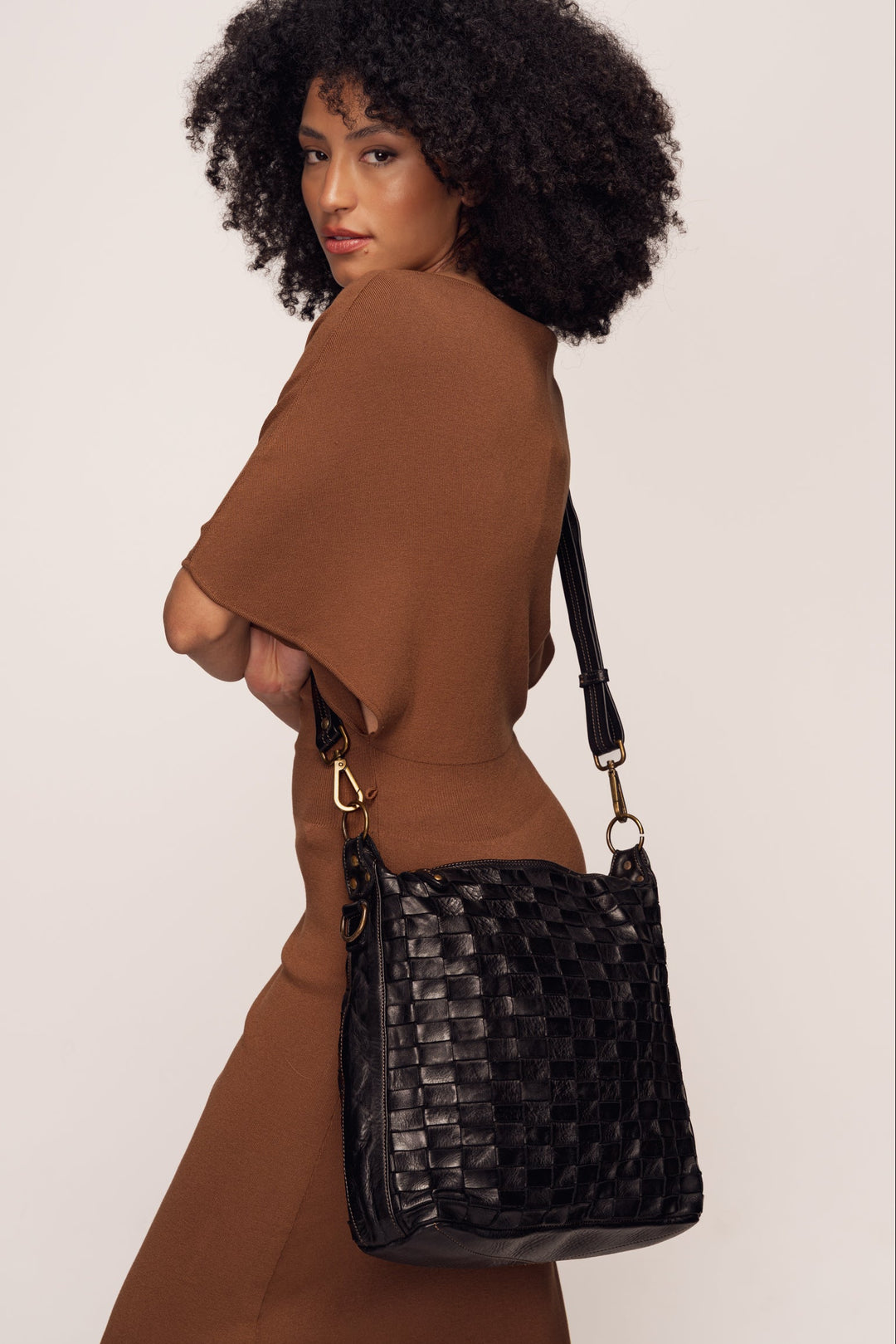 Siena Handwoven Leather Shoulder & Crossbody Bag - Black | Model wearing bag as crossbody