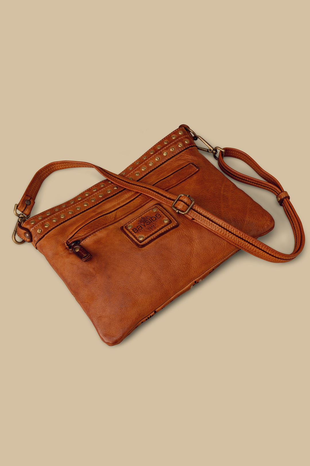 LUSHER WING POUCH COGNAC, BAYSIDE84 POUCH WITH STUDS AND LASER DETAILS, BAYSIDE84 WING POUCH, COGNAC LEATHER CROSSBODY POUCH